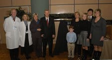  Crow and Stacy Rudnicki, M.D., pose with May and members of his family.