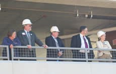 G. Richard Smith, Institute director (second from left) watches with others as the new MRI is installed.