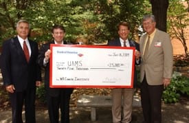 Celebrating the Bank of America donation are (from left) UAMS’ John Blohm, Donnie Cook of Bank of America, and UAMS’ Peter D. Emanuel, M.D., and Chancellor I. Dodd Wilson. 