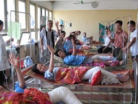 A crowded recovery room followed a busy day of surgery by visiting surgeons in Vietnam.