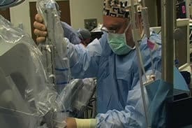 Gareth Tobler, M.D., uses the da Vinci robot to remove a patient’s parathyroid glands.