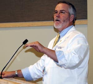 Bobby McGehee, dean of the graduate school, addresses the class of 32 students who earned their white coats. 