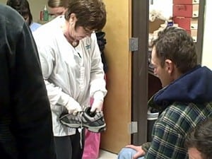 UAMS Department of Orthopaedics volunteers provided foot exams, new shoes and socks for homeless people in central Arkansas.
