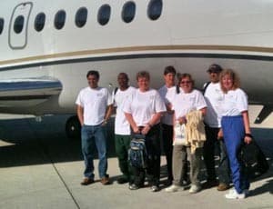 A seven person team from Little Rock, including orthopaedic surgeon Ruth Thomas, M.D. (third from right) and five others from UAMS depart for a weeklong mission trip to earthquake-devastated Haiti.