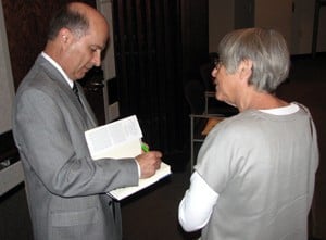 Mannarino autographs his book, “Treating Trauma and Traumatic Grief in Children and Adolescents,” for Doris Schuldt of Ozark Guidance.