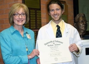 Cynthia Kane, Ph.D., presented Steven McKee with the Horace Marvin Award at a recent ceremony. Marvin’s bust is at right.