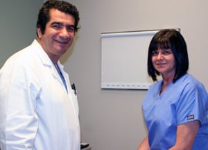 Hakan Paydak, M.D., with Glenda Kay Newton Wood during a follow-up visit after he cured her irregular heartbeat.