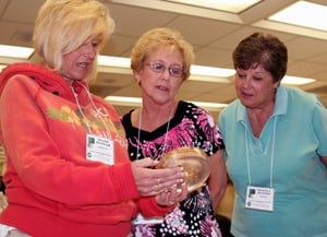 High school teachers from northeast Arkansas look at a slice of brain tissue during a visit to UAMS.
