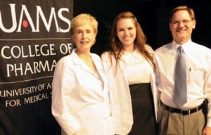 Mary Reinhardt center, with her parents, Dr. Melanie Reinhardt ’81, assistant professor of Pharmacy Practice, Dr. Garry Reinhardt ’79, all of Little Rock.