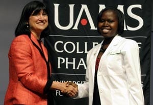 UAMS College of Pharmacy Dean Stephanie F. Gardner, PharmD., Ed.D., congratulates first-year student Winnie Bennett. 