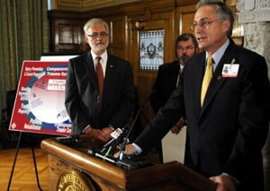 UAMS Chancellor Dan Rahn, M.D., speaks at the state capitol news conference announcing the Level I trauma designation for UAMS Medical Center. From left, state Rep. Gene Shelby, M.D., of Hot Springs and Paul Halverson, Dr. PH., director of the Arkansas Department of Health, look on.