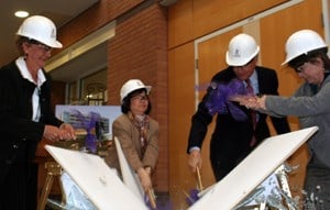 (L-R) Charlotte Gadberry, Jeanne Wei, Dan Rahn and Robin Armstrong break the ceremonial ceiling tile at the Reynolds Institute on Aging. 