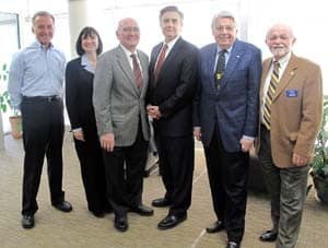 Joining College of Pharmacy Dean Stephanie Gardner (second from left) and UAMS Vice Chancellor for Development John Blohm (fourth from left) for the grant announcement are members of the UAMS Northwest Advisory Board (from left) Carl Collier, Morriss Henry, M.D., board president, Lewis Epley and Dick Trammel.
