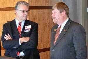 Curtis Lowery, M.D., talks with Rep. Mike Patterson prior to an overview given to a legislative panel on UAMS' $102 million federal broadband grant.