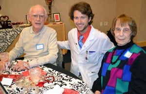 Second-year medical student Steven McKee visits with John and Joyce Jones of Little Rock during the Young Hearts Luncheon hosted at the Institute on Aging.