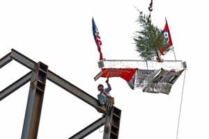 The final beam, with flags, banners and a ceremonial tree attached, was placed atop the Reynolds Institute on Aging. 