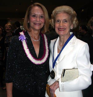 Sue Williamson stands alongside Association of Fundraising Professionals President Paulette Maehara.