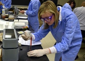 Melissa Bloch, of Alexandria, La., works in the compounding lab during the fifth annual Pharmacy Camp. 