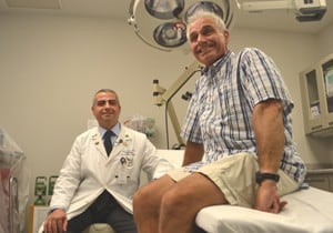 In a surgery performed by UAMS’ Emre Vural (left), Pat Longinotti was the first patient in Arkansas to benefit from the robotic removal of a cancerous throat tumor. 