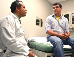 UAMS’ Mohamed Kamel, M.D., speaks with Colton Waters two months after Waters’ surgery.  