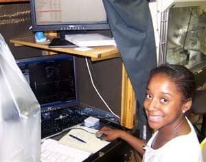 Breana McElroy, a student in the Summer Research Internship Program, works in a UAMS lab.