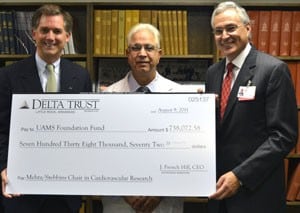 Frehcn Hill, CEO of Delta Trust; Jay Mehta, M.D., Ph.D., associate director of the Gene Therapy Program at UAMS; and UAMS Dan Rahn, M.D.