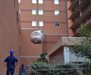 A nearly 10,000-pound section of a new MRI unit is installed at the UAMS Medical Center