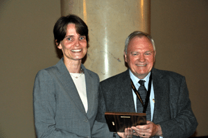 UAMS’ Marjan Boerma, Ph.D., (left) received her award from Peter O’Neill, Ph.D., the former president of the Radiation Research Society.