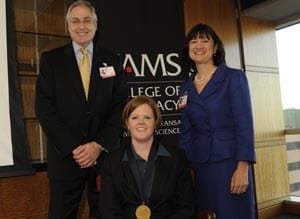 UAMS CHancellor Dan Rahn, M.D., and College of Pharmacy Dean Stephanie F. Gardner, Pharm.D., Ed.D., congratulated Holly Maples, Pharm.D., after being invested with the Jeff and Kathy Lewis Sanders College of Pharmacy Endowed Chair in Pediatrics. 