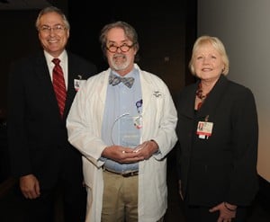 Chancellor Dan Rahn, M.D., (left) and College of Medicine Dean Debra Fiser, M.D., with award recipient Jeffrey Clothier, M.D.