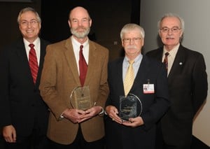 Chancellor Rahn and College of Public Health Dean James Raczynski, Ph.D., with award recipients Keith Williams, Ph.D., and John Baker, Ph.D.