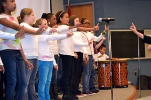 A choir from Booker Arts Magnet School performs.