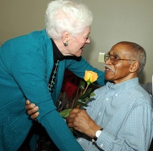 Betty Jo Ward, wife of the late Chancellor Emeritus Harry P. Ward, M.D., visits with Charles White. 