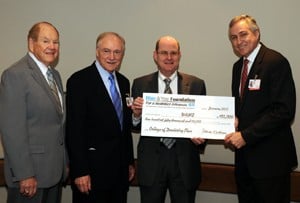 (L-R) UAMS’ William Slagle, associate director of the Center for Dental Education and Charles Cranford join Patrick O'Sullivan, executive director of the Blue & You Foundation for a Healthier Arkansas and UAMS Chancellor Dan Rahn as Blue & You presents a $150,000 grant to developing strategies for establishing a UAMS College of Dentistry.