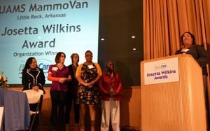 Kimberly Enoch accepts the Josetta Wilkins Award on behalf of the MammoVan staff, with (left-right) Ronda Henry-Tillman, M.D.; Heather Buie; Stephanie McLean; Shakia Jackson; and Josetta Wilkins.