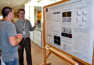 Graduate student Joseph Graham talks about his work during Student Research Day.