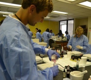 Jared Dietz, a senior from Searcy, enjoys getting hands-on experience in the compounding lab during Pharmacy Camp.