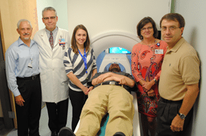 At a recent open house and demonstration of the MRI simulator are (l-r) Clint Kilts, Ph.D., BIRC director, Curtis Lowery, M.D., TRI director, Sonet Smitherman, MRI coordinator, Jonathan Young, BIRC clinical research coordinator, Lisa Jackson, J.D., R.N., TRI executive director, and Mike Owens, Ph.D., director of TRI’s Novel Methodologies and Pilot Studies program. 