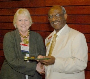 College of Medicine Dean Debra H. Fiser, M.D., congratulates Sterling Williams, M.D. ’73, Ph.D., after presenting him with the 2012 Dean’s Distinguished Alumnus Award.