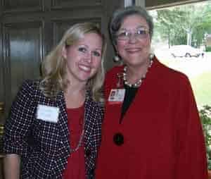 Auxiliary member Elizabeth Meyer shares a moment with Janie Lowe, director of the Cancer Institute Department of Volunteer Services and Auxiliary.