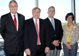 Those attending the TRI-sponsored reception for the Clinton School included (l-r) Chancellor Dan Rahn, M.D., Clinton School Dean Skip Rutherford, TRI Director Curtis Lowery, M.D., and TRI Executive Director Lisa Jackson, J.D., R.N.