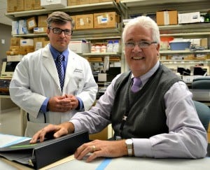 Kent McKelvey, M.D., (left) and Larry Suva, M.D., are leading UAMS researchers studying the causes behind the high rate of broken bones in those with Down syndrome.