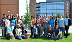 Members of the College of Medicine Class of 2015 pose with one of the trees they donated.