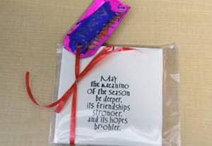 2. Each of the coasters created by the students displays in inspiring holiday message.