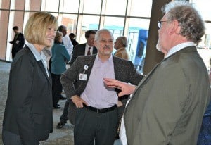 Townsend greets Psychiatric Research Institute Director G. Richard Smith (right) and  Clint Kilts, Ph.D., director of  the institute’s Brain Imaging Research Center.