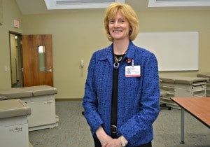 Patricia Kelly, Ph.D., chair of the Department of Physician Assistant Studies, stands in the recently finished physicial exam lab for the physician assistant program.