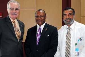 UAMS College of Public Health Dean Jim Raczynski, Ph.D., and UAMS Vice Chancellor for Diversity and Inclusion Billy Thomas, M.D., welcome Stephen B. Thomas, Ph.D.,  (center) from the University of Maryland Center for Health Equity. 