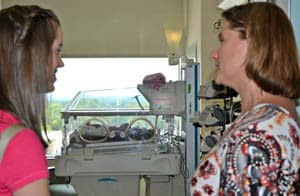 Chloe Davis and her mother, Sandy Davis, view the private rooms at UAMS for premature babies.