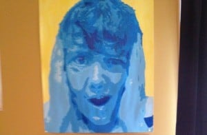 Five shades of blue paint compose Ryan Longood’s monochromatic eighth-grade “Self Portrait.”
