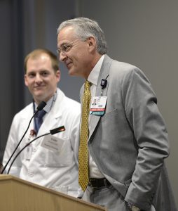Chancellor Dan Rahn, M.D., and medical student Evan Branscum address lawmakers during Legislator Day at UAMS.